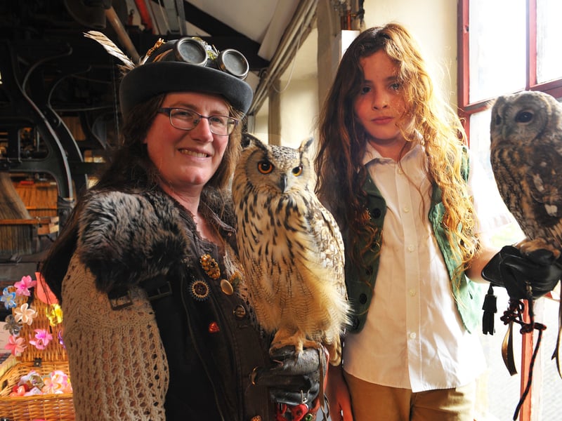 Amy Lawrence of The Flying Squadron with her Bengal eagle owl and Flynn Holmes, 8, with a tawny owl.