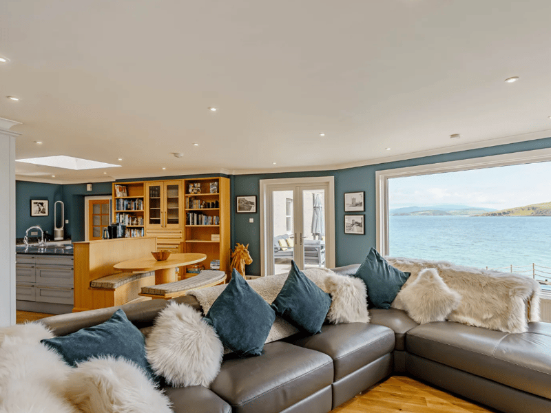  A spacious open-plan kitchen and dining space offers a snug sitting area.