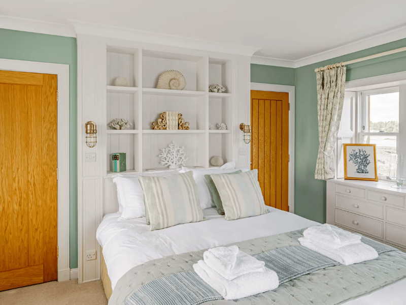 The ground floor also hosts a double bedroom with a TV and access to a Jack-and-Jill bathroom, perfect for those with limited mobility.