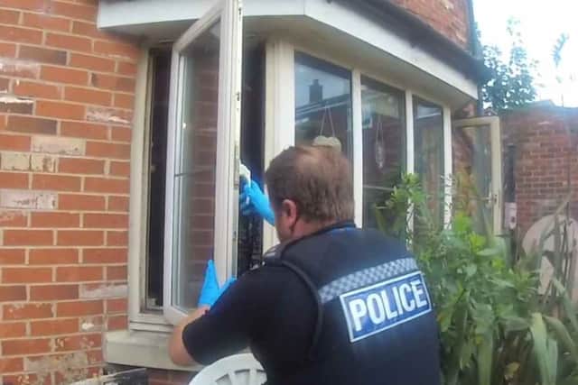 Police officers had to remove part of a window to get into a property after an XL Bully mauled a man