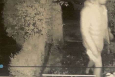 A screenshot from CCTV on August 13, 2025, of a man approaching a home in the Stalker Lees Road area.