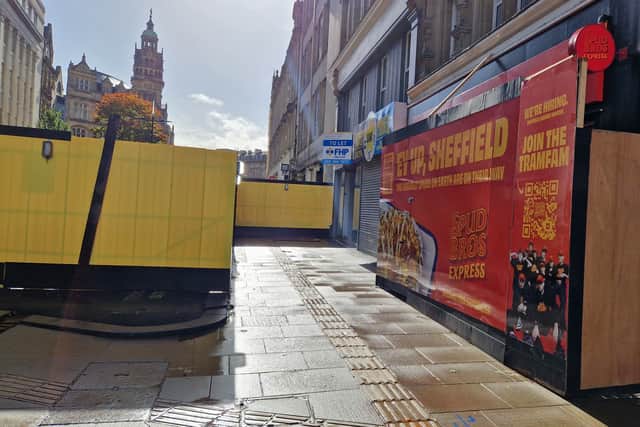 Shops on Fargate have been left 'invisible' behind a yellow wall around a builders' compound, it is claimed