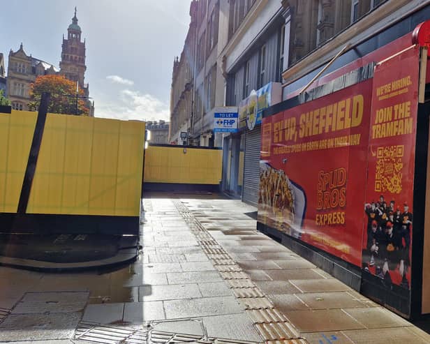 Shops on Fargate have been left 'invisible' behind a yellow wall around a builders' compound, it is claimed