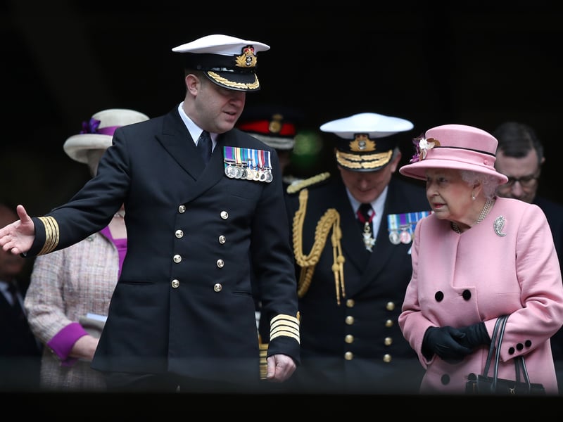 Queen Elizabeth II and Captain of HMS Ocean Captain Rob Pedre attends the decommissioning ceremony for HMS Ocean at HMNB Devonport on March 27, 2018 in Plymouth, England.
