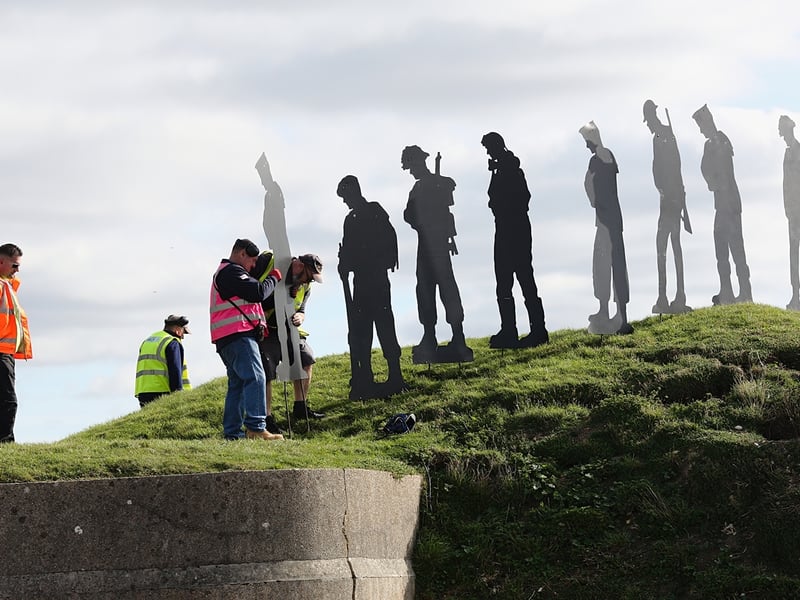 Volunteers installing the tribute at Fort Nelson