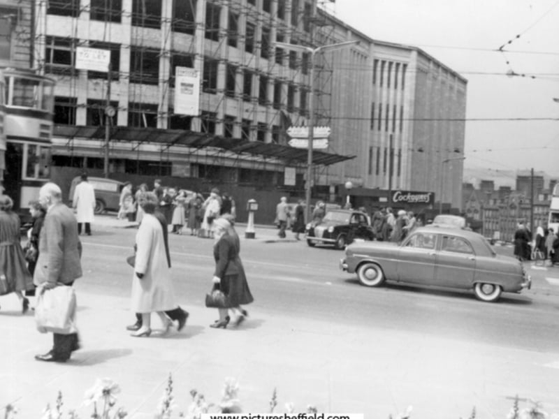 It meant there was need for major rebuilding after the war. By the 1950s, some rebuilding had taken place, and cars and trams were back on the roads at the junction. Plants and small 'cabin' shops made up part of the area. But there were grander plans. Photo: Picture Sheffield.