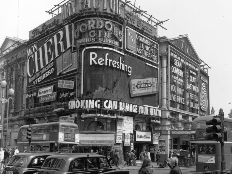 Adverts at Piccadilly Circus, London, in May 1971, promoting products including Wrigley's chewing gum, Gordon's Gin and Mon Cheri liqueur chocolates