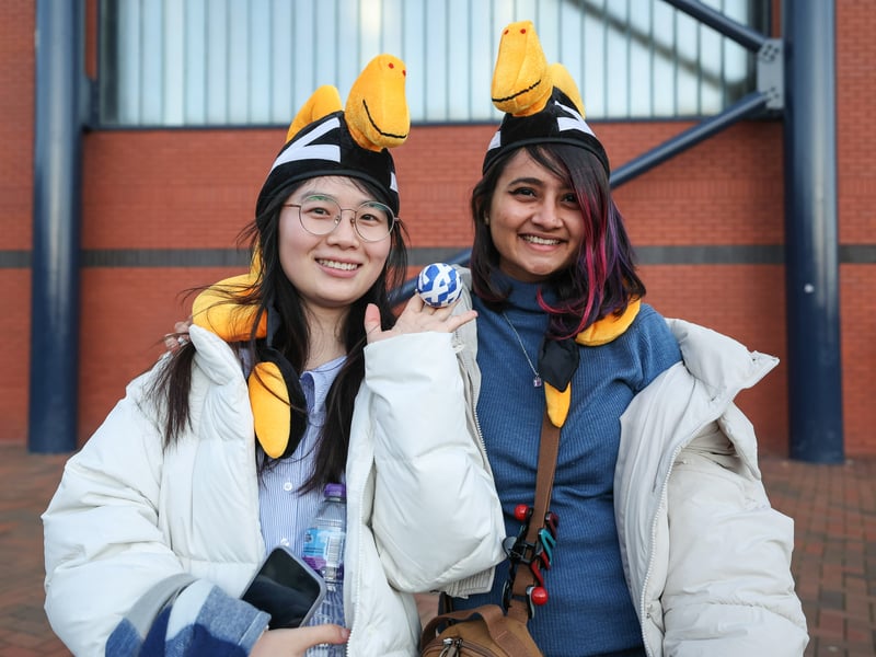 Two Scotland fans show off their fancy hats before kick-off.