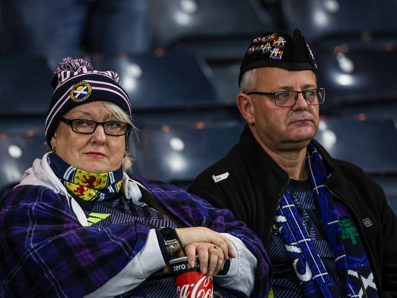 A couple of Scotland fans during a 2026 FIFA World Cup qualifying match between Scotland and Greece at Hampden Park.