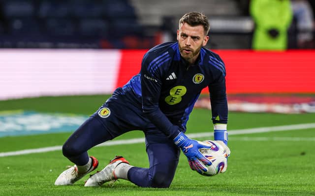 Didn't have many saves to make until producing an outstanding reaction stop to deny Karetsas in the closing stages, acrobatically tipping the ball over the bar. Had no chance with Tsimikas' opener. Hard to see him being displaced as Scotland's No. 1 going forward.