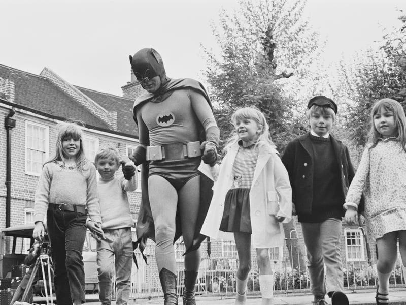 The American actor Adam West, dressed as 'Batman' for the filming of a road safety advert for children, in May 1967