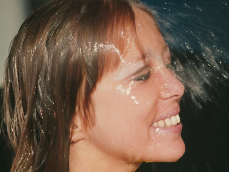 English model Pattie Boyd filming a commercial for Dop Pearlized Shampoo by L'Oreal in 1966