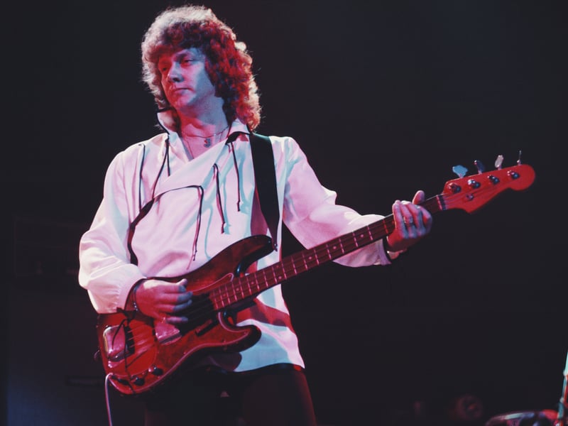 English musician and bass guitarist with The Moody Blues John Lodge has died aged 82. His family said he was "suddenly and unexpectedly taken", but they did not give a cause of death. He is pictured live on stage performing the album Blue Jays in 1975. (Photo by Michael Putland/Getty Images)