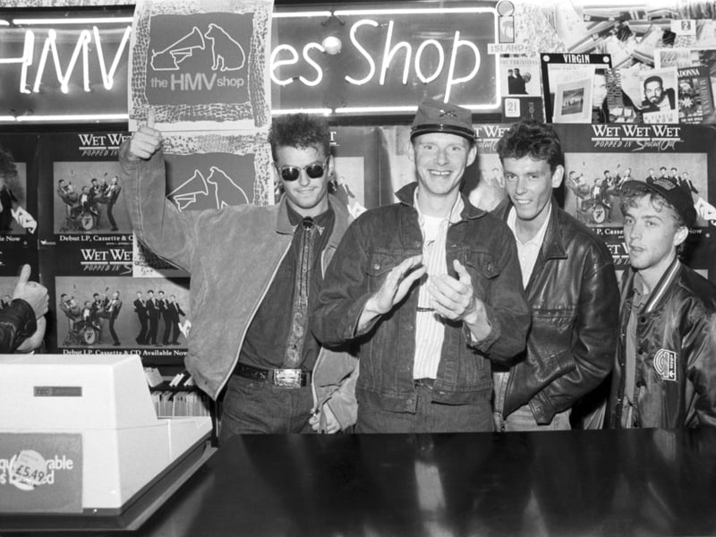 Scottish band Wet Wet Wet at the HMV shop on Princes Street, Edinburgh, where they signed records in September 1987. Pictured from left to right are Marti Pellow, Tommy Cunningham, Graeme Clark and Neil Mitchell.