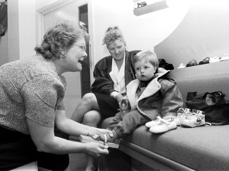 18-month-old Mark Robertson gets his feet measured for new shoes at children's shoe shop Russell & Bromley on Edinburgh's Princes Street in May 1989