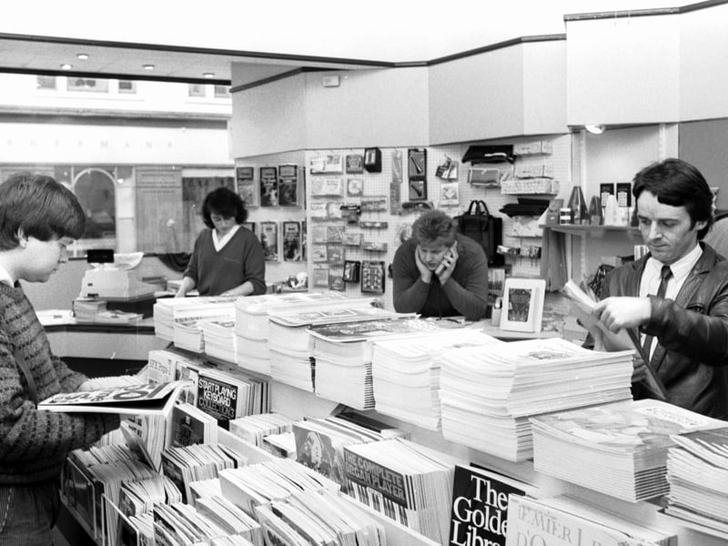 Customers looking at musical instrument tuition books in Rae MacIntosh (Music)'s newly-refurbished shop on Queensferry Street, Edinburgh, in 1988