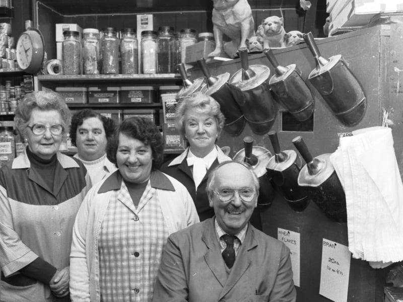 Robert Thomson, grandson of the original owner, and the staff of Robert Thomson's, a traditional victuallers selling dry goods in Edinburgh's West Port, in February 1986