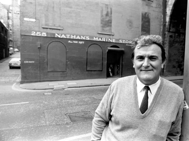 Owner Brendan O'Brien outside Nathan's Marine Stores, a rag shop in Cowgate, Edinburgh, in July 1988