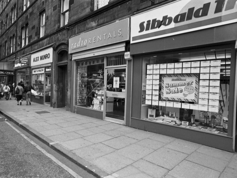 Shops on Great Junction Street, Leith, Edinburgh, including Radio Rentals, Alex Munro, and Sibbald Travel, in July 1988