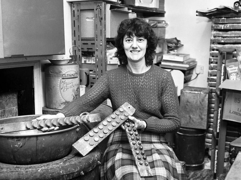 Maria Raffaelli, owner of a sweet shop on West Maitland Street, Edinburgh, with traditional sweet moulds, in June 1984