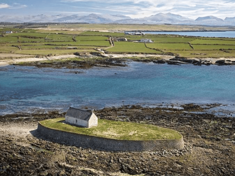 Porth Cwyfan, also known as Church Bay, is tucked away on Holy Island’s south coast. Located near the village of Aberffraw, it is best known for the tiny whitewashed church of St Cwyfan, which stands alone on a tidal island just offshore.  It earned an average of 4.8 stars and a total of 87 reviews.	