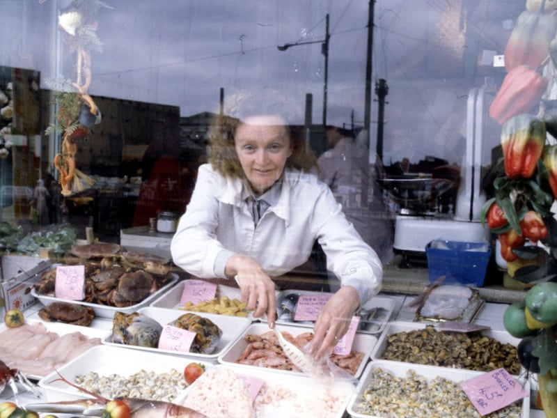 Betty McAllister at the window of her fish shop at The Barras market in Glasgow, in July 1982