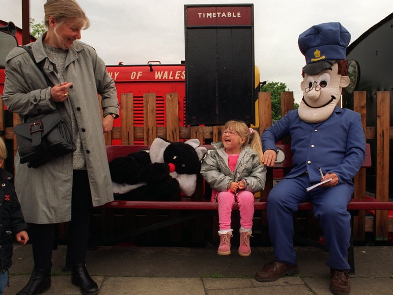 Chloe Bottom meets Postman Pat and his cat Jess at Middleton Railway in May 1997.