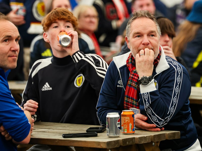 Scotland fans tuck into an Irn-Bru in the fanzone ahead of kick-off at Hampden Park.