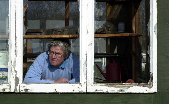 Tony Fitzgerald, chairman of the Clark Fields Allotments, surveys the damage caused by vandals in March 2003.