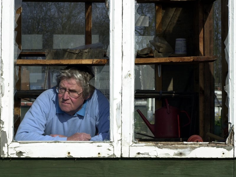 Tony Fitzgerald, chairman of the Clark Fields Allotments, surveys the damage caused by vandals in March 2003.