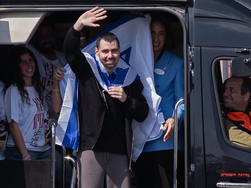 Former hostage Guy Gilboa-Dalal waves to supporters outside Beilinson Hospital in the Rabin Medical Centre in Petah Tikva, Israel 
