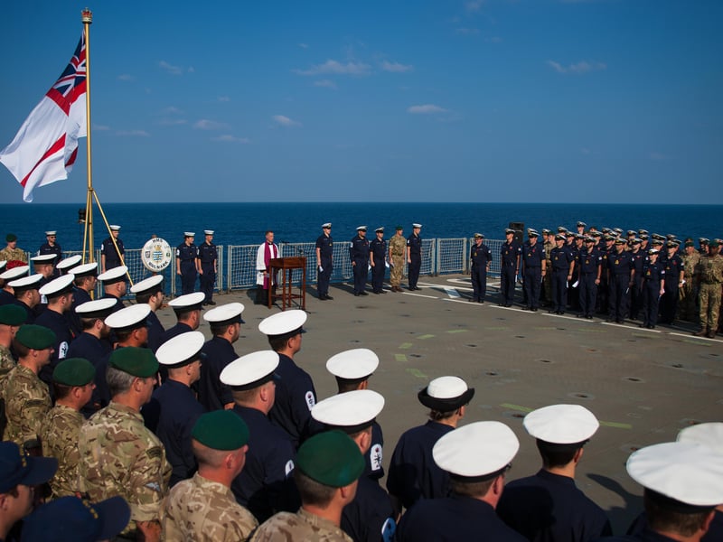The crew of HMS Bulwark and the embarked company  of 42 Commando Royal Marines from Plymouth took part in a Remembrance Day service off the coast of Somalia and remembered a former member of the crew.