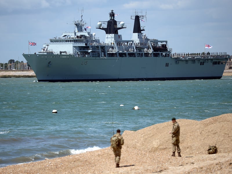 British naval vessel HMS Bulwark sails past during D-Day commemorations in Portsmouth in southern England on June 5, 2014. Several hundred surviving veterans of the 1944 D-Day landings are commemorating the 70th anniversary of the mission on both sides of the English channel.