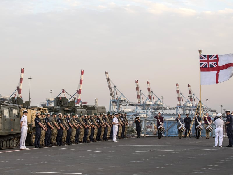 Members of the British Royal Navy take part in a rehearsal of an official ceremony aboard the HMS Bulwark naval vessel as it docks at the port in the Israeli coastal city of Haifa, on November 22, 2016 as part of its mission in the Mediterranean sea.