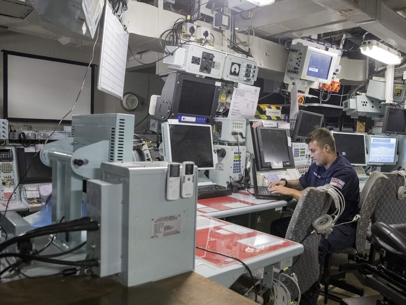 A member of the British Royal Navy works aboard the HMS Bulwark naval vessel as it docks at the port in the Israeli coastal city of Haifa, on November 22, 2016, as part of its mission in the Mediterranean sea. 