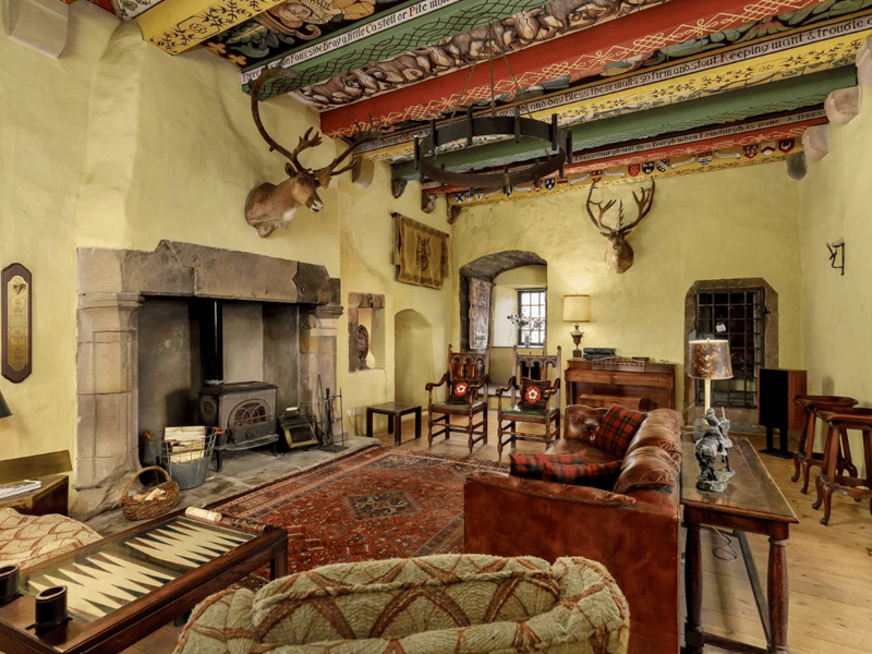 The front door leads to a hall with a flagstone floor and beamed ceiling. Off the hall is a utility room and then the corridor then leads to a back door to the garden and also to the main stairwell. The open plan kitchen and sizeable dining area may have an historic vaulted ceiling but it is also very practical for modern family living. At the top of the 14th century old tower lies what the current owners use as their B&B holiday accommodation. A staircase also leads to the Great Hall. This magnificent old room has an original stone built fireplace with a log burning stove.