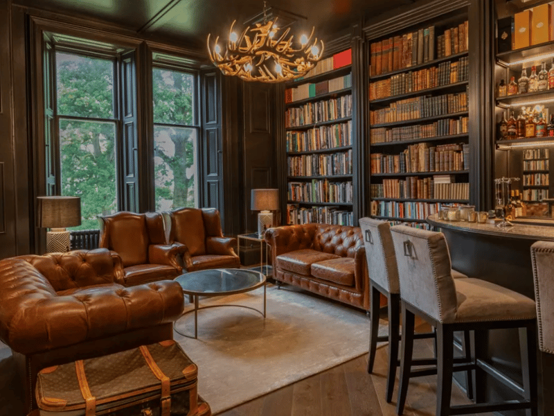 The ground floor accommodation includes a statement drawing room with a high ceiling and original cornicing. There is an impressive dining room with new tartan carpets, cementing the Highland aesthetic. A favourite room in this castle is the custom hand-made library, complete with a new marble top bar.