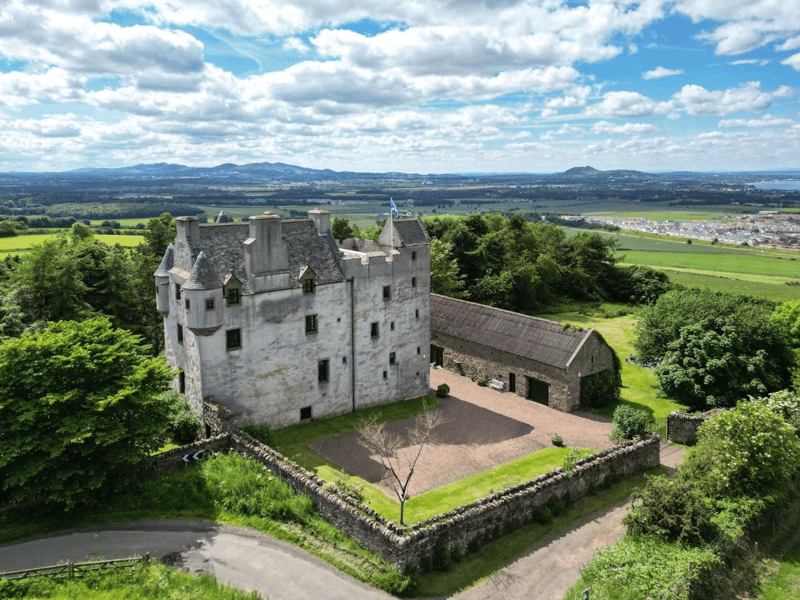 Fa'side Castle is a 14th-century keep located in East Lothian. The building was restored in the 1980s and is now protected as a category B listed building. The castle has panoramic views over the Lothians and the Forth Estuary. There are six bedrooms and three bathrooms. It is on the market with Savills for offers over £1.3 million.