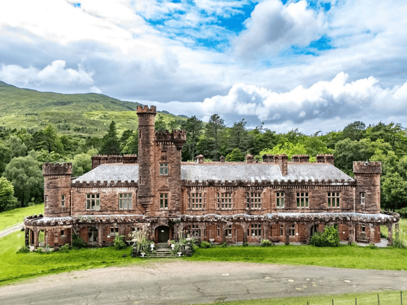 Kinloch Castle, on the eastern shore of the Isle of Rum, is an Edwardian mansion that was built as a private residence for Sir George Bullough. The castle is a Category A listed building and retains many of its original features, including elaborate wood panelling, stained glass, and a rare orchestrion.
Kinloch Castle is said to be a 'living museum', with all contents of the property included in the sale. The contents are a reflection of Sir George Bullough's global travels and lavish taste. Between 1892 and 1895, he amassed an eclectic collection of treasures, most of which remain in the castle today. It is on the market with Savills for offers from £750,000.