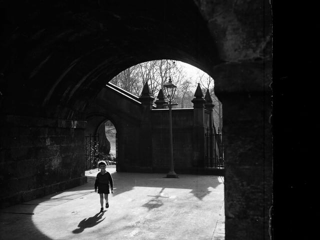A little boy on the path to Saunders Street, in Edinburgh's Stockbridge area, in March 1957.