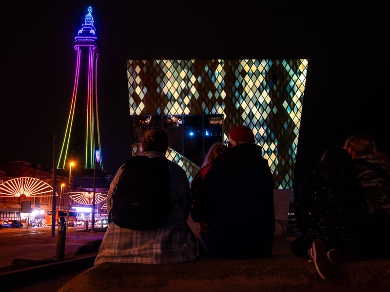Over at the Wedding Chapel, artist Ant Dickenson will debut Sun Glitter - a serene projection inspired by sunlight dancing on water, turning the curved glass façade into a canvas of calm, rippling light.