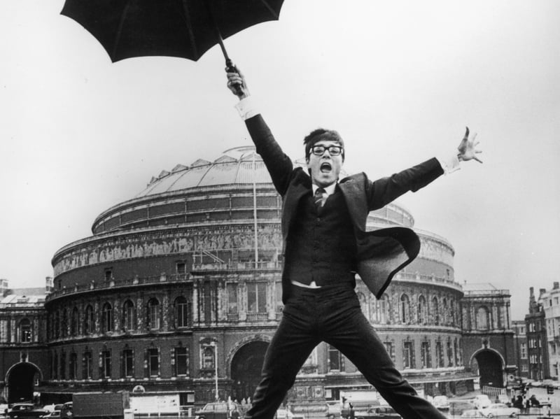 A young Cliff Richard leaps into the air outside the Royal Albert Hall, London, where he is to represent the UK in the Eurovision Song Contest, in October 1967. His performance of Congratulations lost by one point to Spain's entry, La La La.
