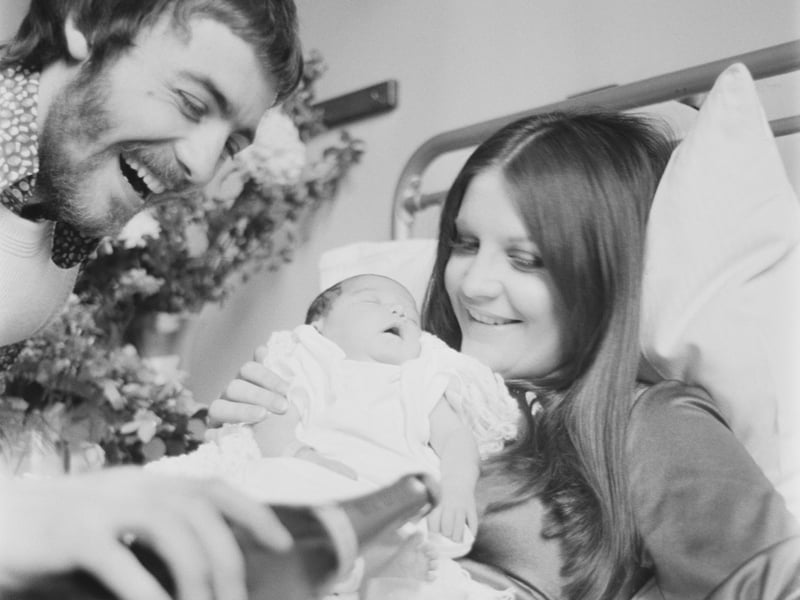 Singer Sandie Shaw with her husband, Welsh fashion designer Jeff Banks, and their new baby daughter, Gracie, in March 1971