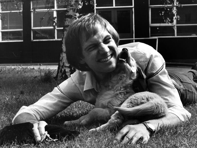 Blue Peter presenter Simon Groom, with the show's new golden retriever puppy Goldie, named by viewers, in 1978