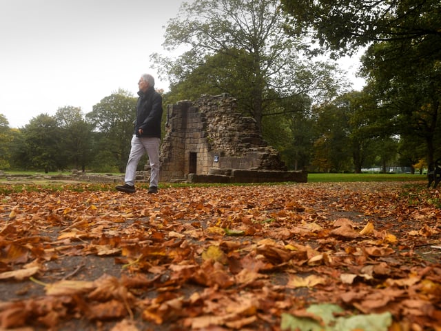 A gentleman makes his way through the fallen Autumnal leaves at Kirkstall Abbey. 
 

