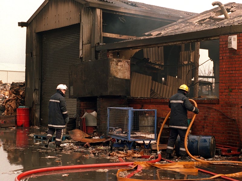 April 1997 and firefighters dampen down following the blaze at S & W Cartons Ltd on Brown Avenue.