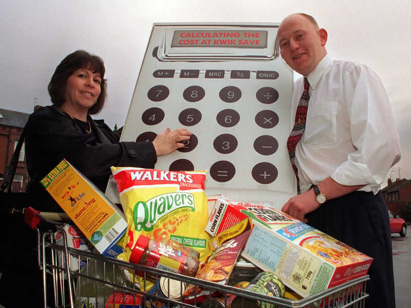 Susan Watson receives her prize at Kwik Save supermarket from store manager Jason Redshaw after she took part in the Calls Cut Costs Helpline scheme. Pictured in January 1998.