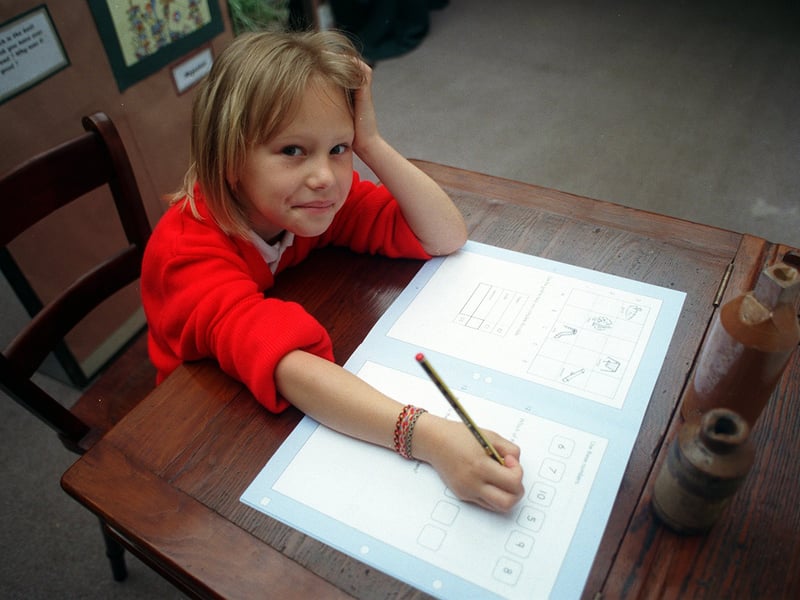 Stacey Robinson goes back in time while working on a refurbished old desk at Ingram Road Primary School in June 1998.