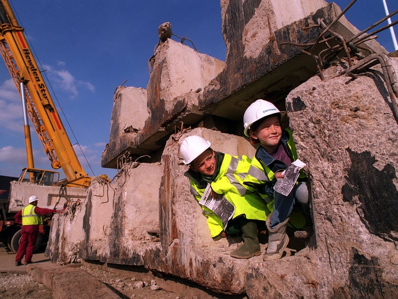 Ingram Road Primary School pupils Matthew Judge and Helen Moran are pictured amongst the old Dewsbury Road bridge beams during their onsite visit to the M621/M1 link road in October 1995.