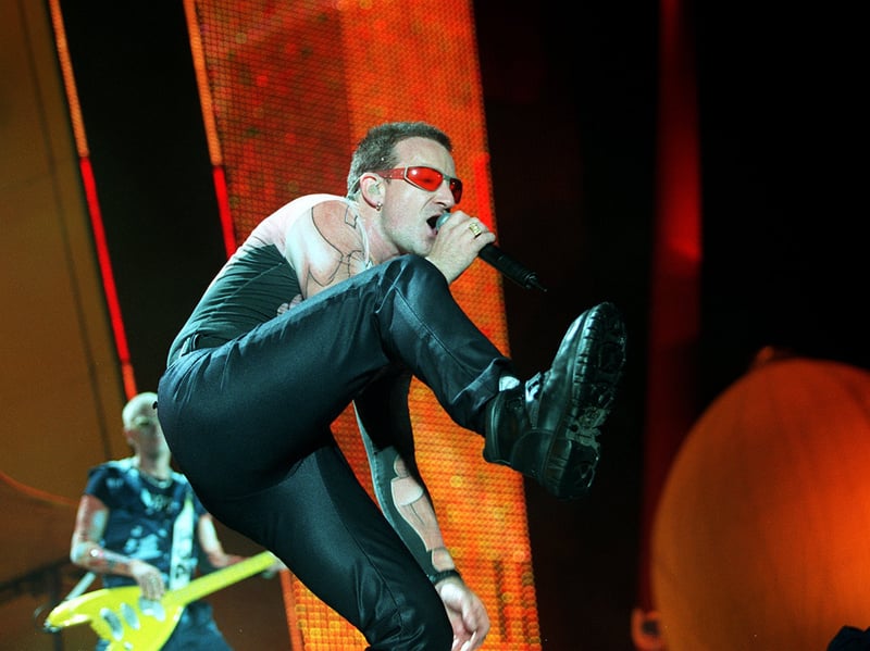 Lead singer of the supergroup U2, Bono, pictured during their concert at Roundhay Park, Leeds, in August 1997